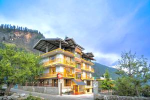a large building with a solar panel on top of it at Manali Golden Valley in Manāli