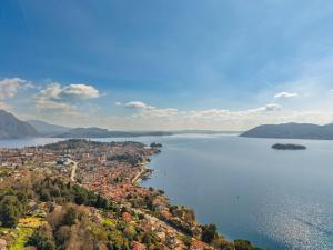 an aerial view of a city and a body of water at Villa Suna Paradiso in Verbania