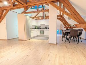 a kitchen and dining room with a table and chairs at Loft in Weiler in Weiler