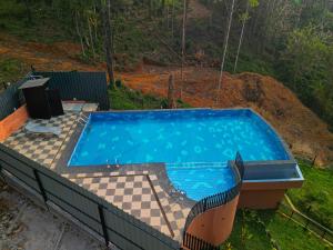 an overhead view of a swimming pool in a yard at Kashmeeram Vythiri Wayanad Premium Pool Resort in Vayittiri +55 photos