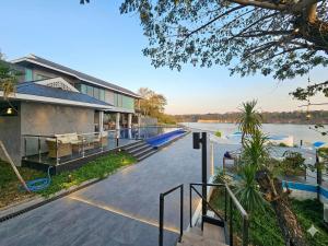 a house with a view of a river at The Lakeside Sanctuary in Ban Mae Cho