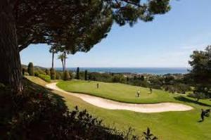 a golf course with people playing on a green at La Casita - Boutique Retreat Barcelona Coast Sea View in Sant Andreu de Llavaneres