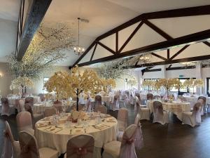 a banquet hall with white tables and chairs at Asquith Hall Hotel & Spa Scarborough in Scarborough +62 photos