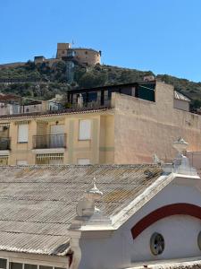 a view of a building with a tile roof at Piso Loli in Águilas