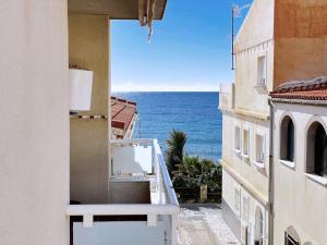 a view of the ocean from the balcony of a building at Comeback Brisa Serena in Rubite