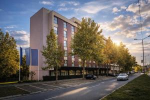 a rendering of a building on a city street at Nobel Inn Hotel in Belgrade
