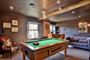 a living room with a pool table at Finest Retreats - Blackton Farmhouse in Barnard Castle