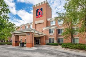 a red brick building with a fedex sign on it at Studio 6 Extended Stay Milwaukee Brookfield WI in Brookfield