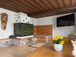 a living room with a fireplace and a flat screen tv at Apartment Alpen Lodge 52 in Aschau