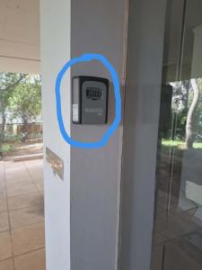 a pay meter on the side of a building at Varkiza Pines Apartment in Varkiza
