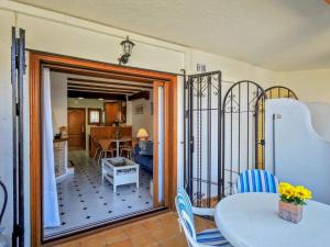 a room with a table and chairs and a kitchen at Beachfront in Denia Alicante in Denia +20 photos