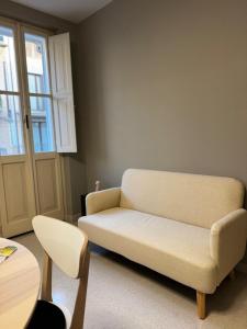 a living room with a couch and a table at Appartamento Rosa Rosa' in Porto SantʼElpidio