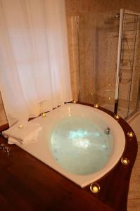 a bath tub in a bathroom with a window at Bienvenue chez Sylvie in Lyon +8 photos