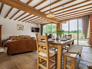 a living room with a table and a couch at 3 Bed in Malton oc-75898 in Amotherby