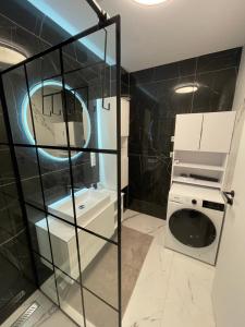 a bathroom with a toilet and a sink at Apartmán beige Bardejovské Kúpele in Bardejov +32 photos