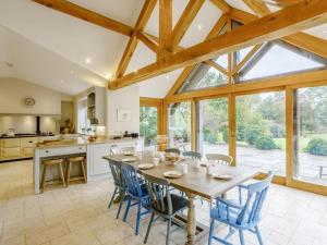 a kitchen and dining room with a table and chairs at 5 Bed in Wincanton oc-79062 in Hilton