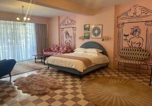 a bedroom with a bed and a couch and a table at Villa Chamoun in Al Wādī +62 photos