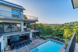 an aerial view of a house with a swimming pool at Yellow-tail Room in Ballito