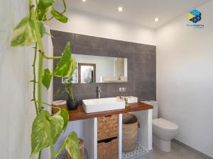 a bathroom with a sink and a mirror at La Caseta de Lola in El Port de la Selva +18 photos