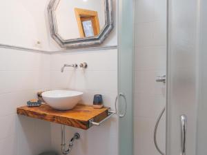 a bathroom with a bowl sink and a shower at La casetta di Mercatello in Bagnoregio +13 photos