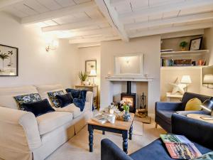 a living room with two couches and a fireplace at 2 Bed in York oc-90906 in Sheriff Hutton