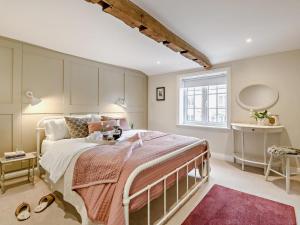 a bedroom with a large bed and a window at 2 Bed in York oc-90906 in Sheriff Hutton