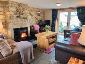 a living room with a couch and a fireplace at 2 Bed in Hexham oc-88214 in Yarrow