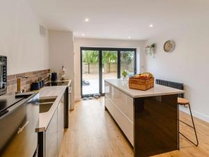 a kitchen with a large island in the middle at 2 Bed in Hull oc-89596 in Ryhill +14 photos