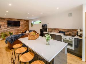 a kitchen and living room with a table and chairs at 2 Bed in Hull oc-89596 in Ryhill