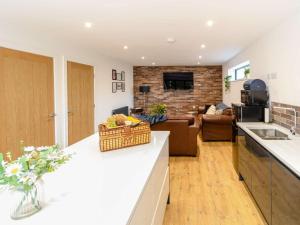 a kitchen and a living room with a couch at 2 Bed in Hull oc-89596 in Ryhill