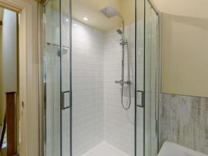 a bathroom with a shower with a glass at 3 Bed in Leyburn oc-89746 in Spennithorne +12 photos