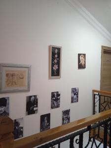 a white wall with pictures of people on it at Midis Park Otel in Şarköy