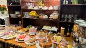 a table with many different food items on it at Hotel Hassler in Asunción