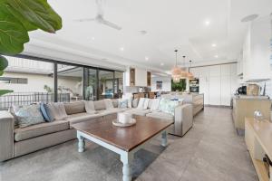a living room with a couch and a table at Octopus Room in Ballito
