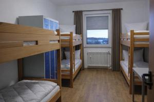 Katil atau katil-katil dalam bilik di Sporthostel Active INN