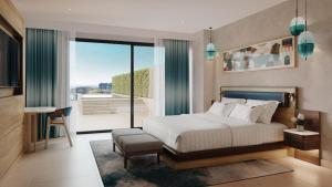 a bedroom with a bed and a large window at Hard Rock Hotel Malta in St. Julianʼs +10 photos