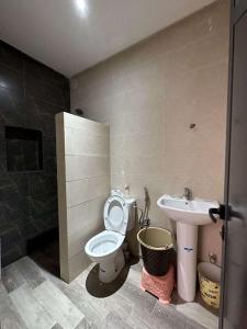 a bathroom with a toilet and a sink at House with beautiful partial sea view in Mirleft +12 photos