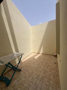 a room with a table and a tiled floor at House with beautiful partial sea view in Mirleft