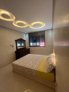 a bedroom with a bed with a ceiling at House with beautiful partial sea view in Mirleft