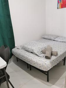 a bed in a room with two pillows on it at 586 Hotel in Toronto