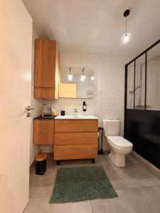 a bathroom with a sink and a toilet at Maison La Bullette à 10 min de Pontarlier in Bulle +62 photos