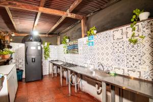 a kitchen with a row of sinks in a room at Casa La Bella Samaria Boutique in Santa Marta