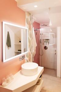 a bathroom with a sink and a shower at Suite Bobo in Monopoli