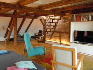 a living room with a table and chairs and a fireplace at Design trifft Denkmal in Wangen im Allgäu