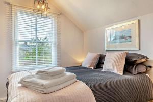a bedroom with a large bed with towels on it at 3 Bed in Belper oc-o28261 in Belper