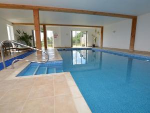 a large swimming pool in a building with a large at 3 Bed in Sherborne oc-folwr in Long Burton