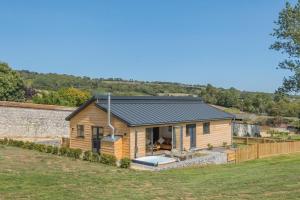 a wooden house with a slate roof at 3 Bed in Adgestone oc-a32613 in Brading