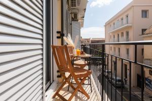 a balcony with a table with drinks on it at Mia's Studio in Corfu
