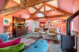 a living room with a wood stove in a room at 1 Bed in Crayke oc-g33754 in Crayke