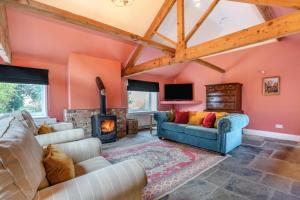 a living room with a couch and a fireplace at 1 Bed in Crayke oc-g33754 in Crayke